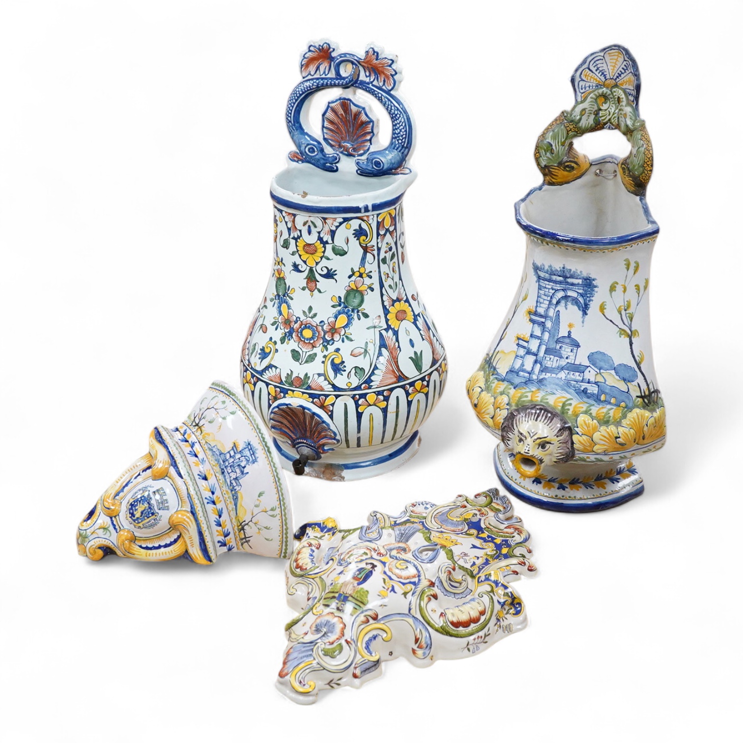 Two French faience large water wall cisterns, a wall pocket and wall bracket, largest 58cm high